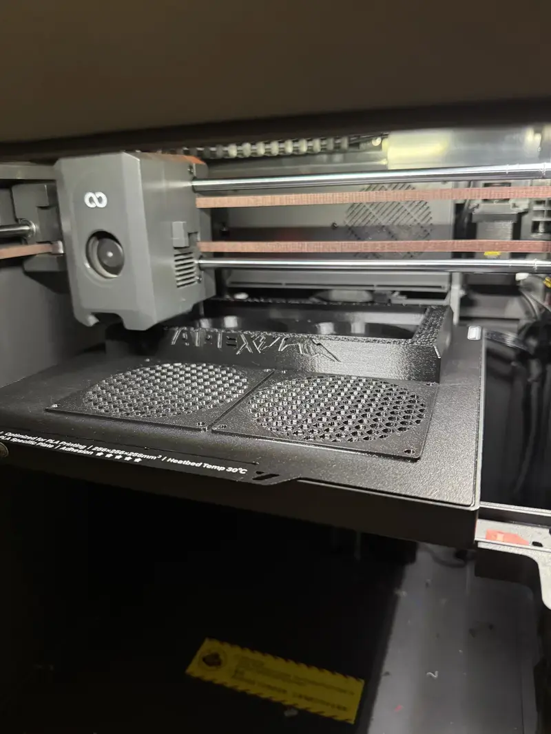 Bambu Lab 3D printer producing Apex-branded part